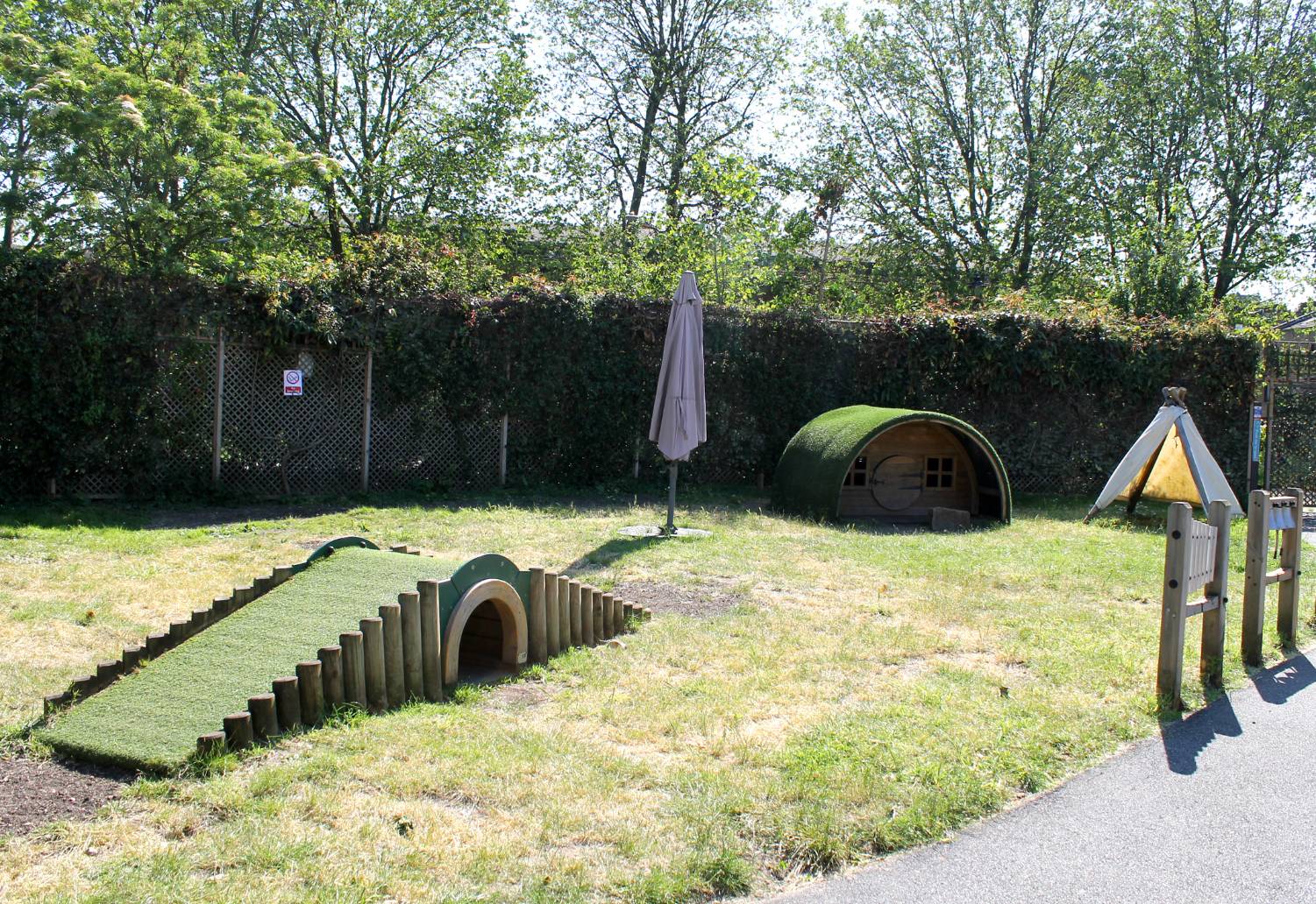 Children’s outdoor play area at Castlehaven with slides and climbing features, perfect for family events.